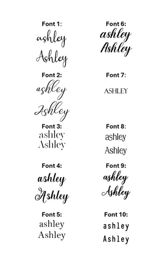 Wooden name tags/ stocking tags hanging on a Christmas tree with decorative lights.