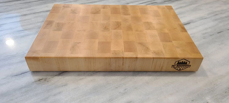 Handcrafted hard maple end-grain cutting board by 207 Woodworks, made in Maine.